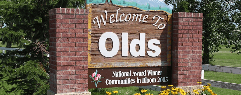Welcome to Olds Alberta sign, with Olds Moving Ltd.